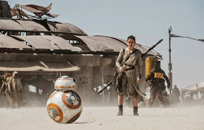 Still of BB8 and Daisy Ridley in Star Wars Episode VII: The Force Awakens