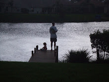 Fishing at sunset with child