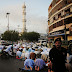 Pakistani Muslim devotees offer Eid al-Adha prayers outside a mosque in Karachi 