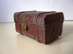 Miniature vintage tin trunk.