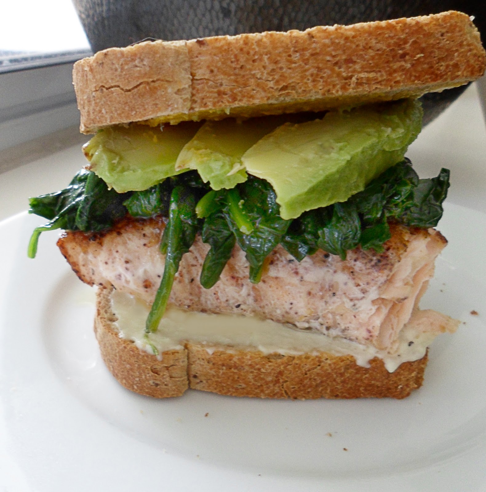 The Tomato Snob Blackened salmon sandwich with avocado and wilted spinach