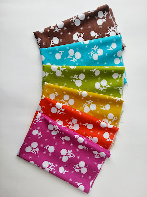 brightly colored modern floral fabric in a rainbow of colors