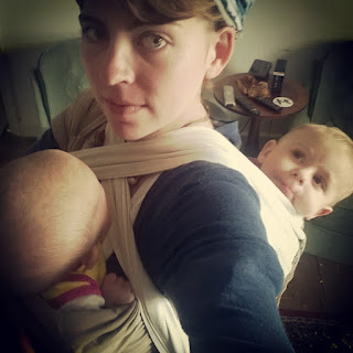 baby wearing two babies, tandem carrying