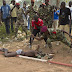 Bangui, Central African Republic -  African Army soldier stabs the corpse of a man