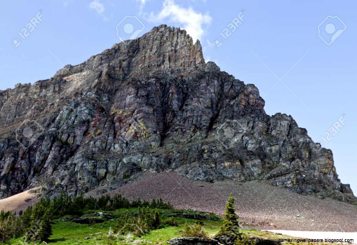 The Top Of A Rugged Rocky Mountain Peak With Various Layers Of The Top Of A Rugged Rocky Mountain Peak With Various Layers Of