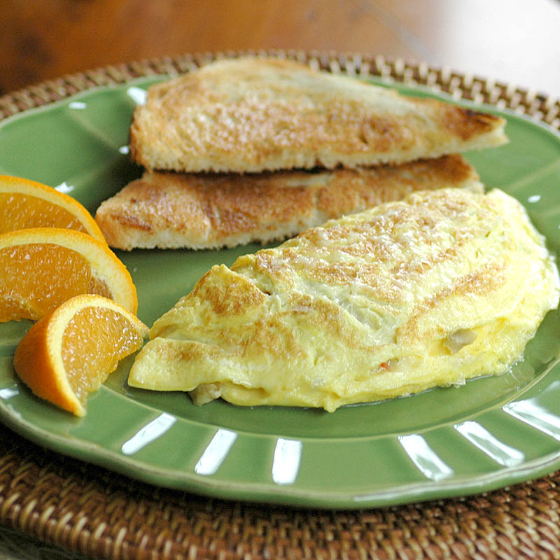 Savoring Time in the Kitchen Swiss Cheese and Green Olive Omelette