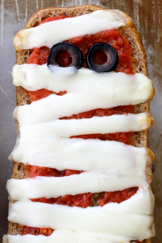 French Bread Pizza Mummies French Bread Pizza Mummies – perfect EASY recipe for your Halloween Party, just 4 ingredients and 15 minutes to make!