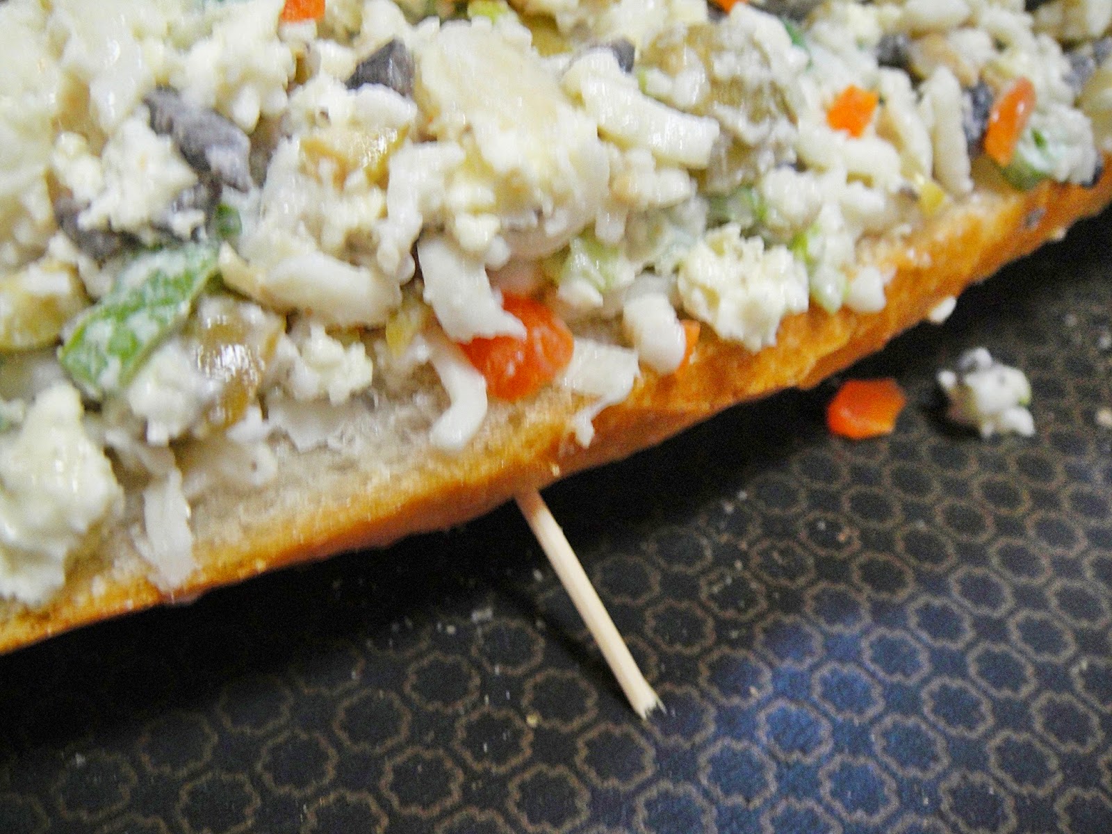 Maryam's Culinary Wonders 713. Cheesy Olive Baguettes