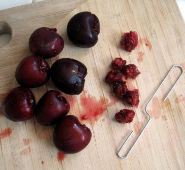 cherries pitted with a paperclip