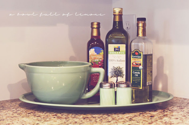 On top of the counter organizing of oils | OrganizingMadeFun.com