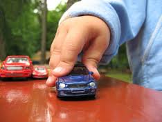 child+pushing+toy+car.jpg