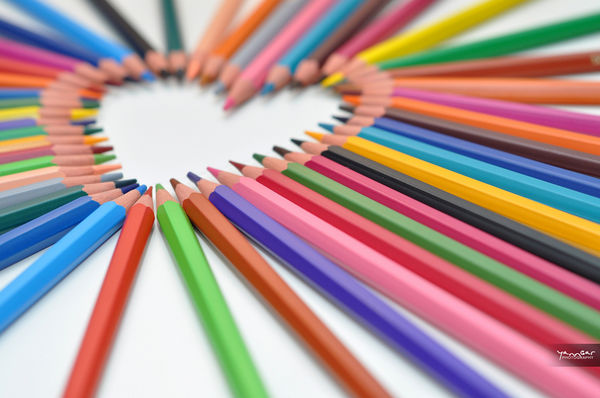colored pencils in a heart shape