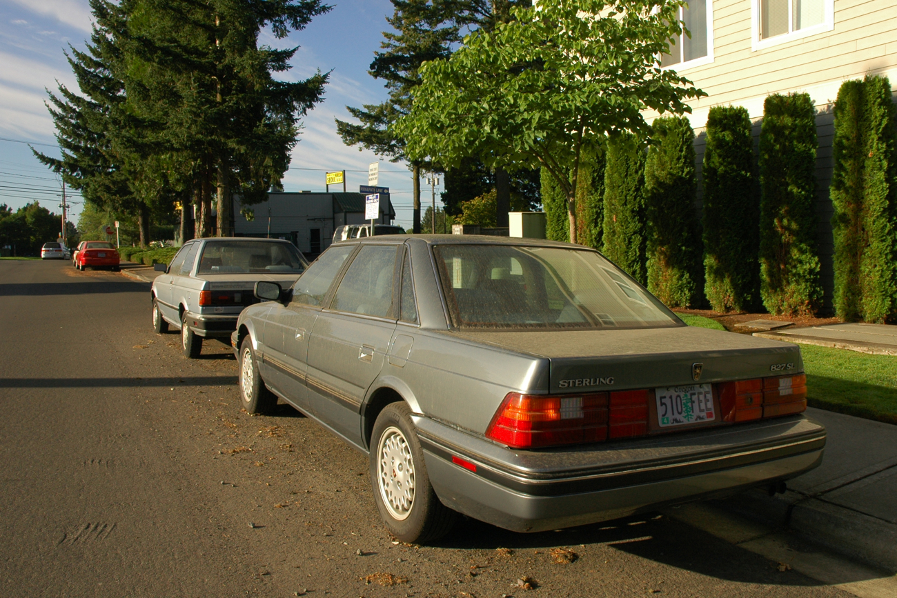 OLD PARKED CARS. 1990 Sterling 827 SL.