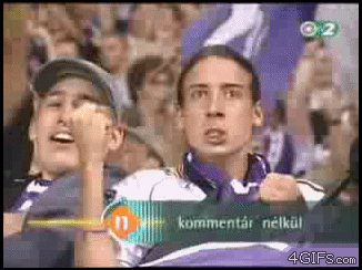Guy cheering in crowd - long hair