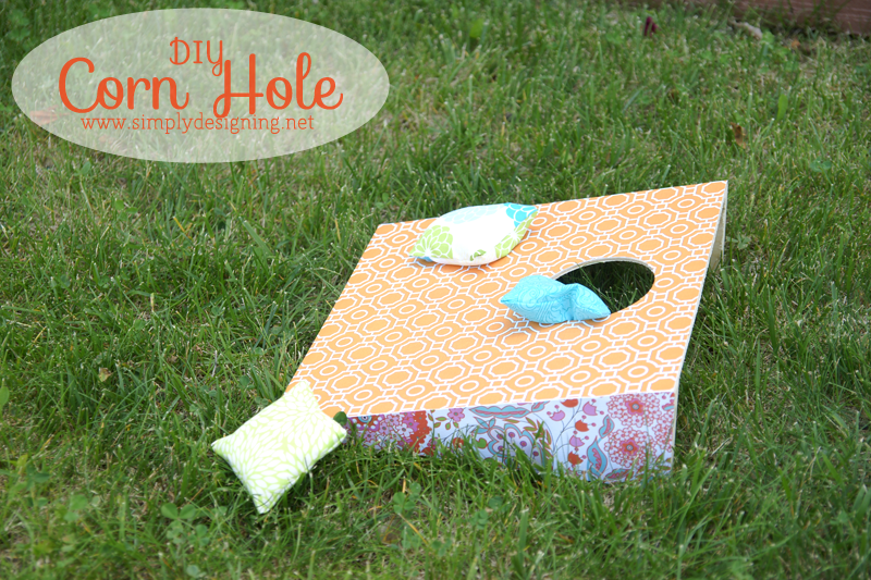 DIY Corn Hole | click to see how to create this really fun and simple corn hole game with bean bags! #cornhole #outdoorgames #kids #crafts