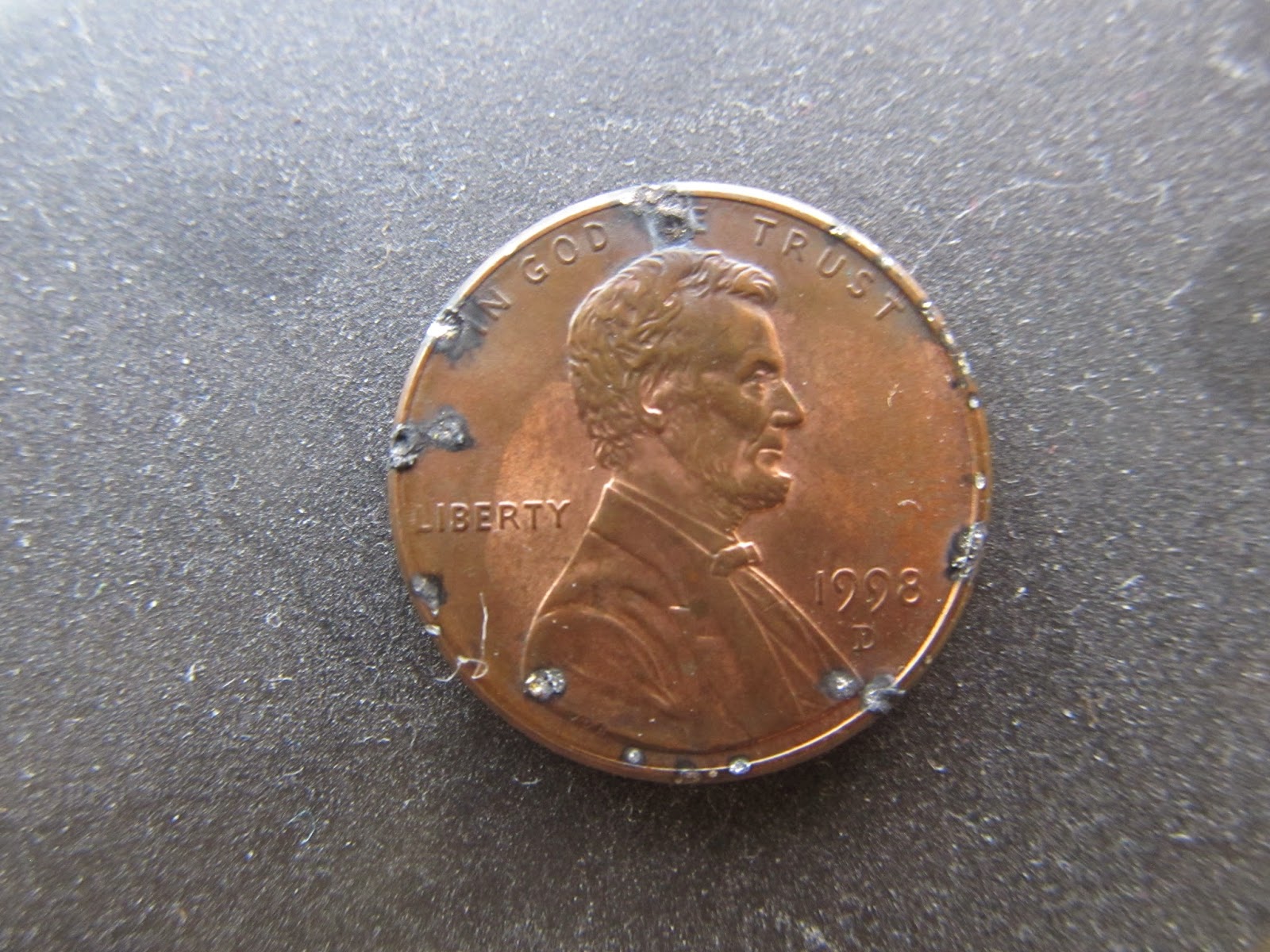 A Penny With Electrical Damage; from being inside of a 2001 Honda odyssey CD Player; www.DarrellWolfe.Com