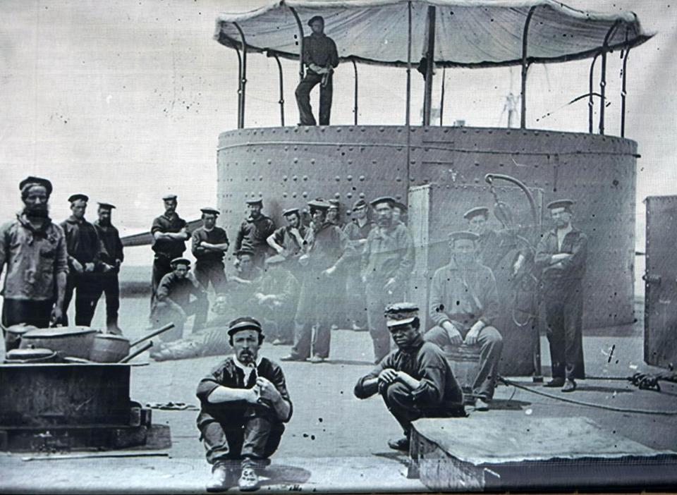 1862. Crew members aboard the USS Monitor, including Siah Carter (right), a black sailor ~