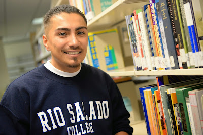 Image of Rio Salado employee wearing a Rio Salado sweatshirt. 