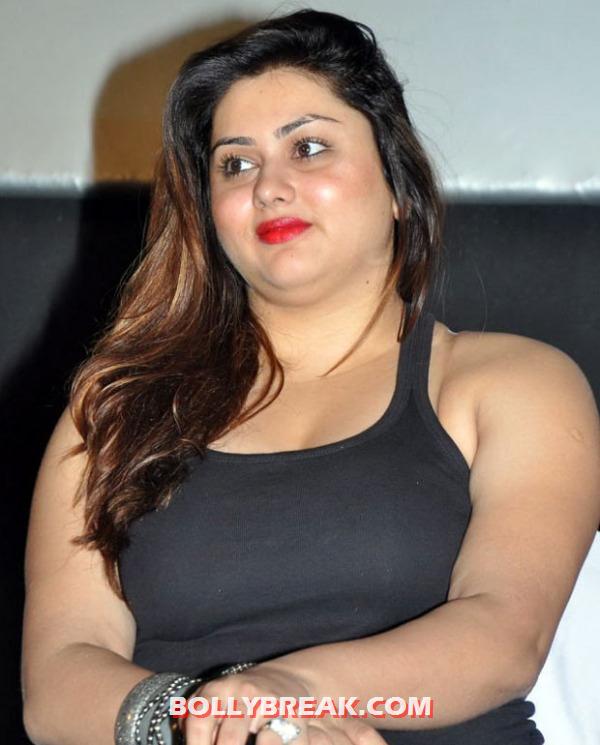 Namitha in a black tank top and black pants and red lipstick to match Namitha in a black tank top and black pants and red lipstick to match - Namitha in an all black outfit