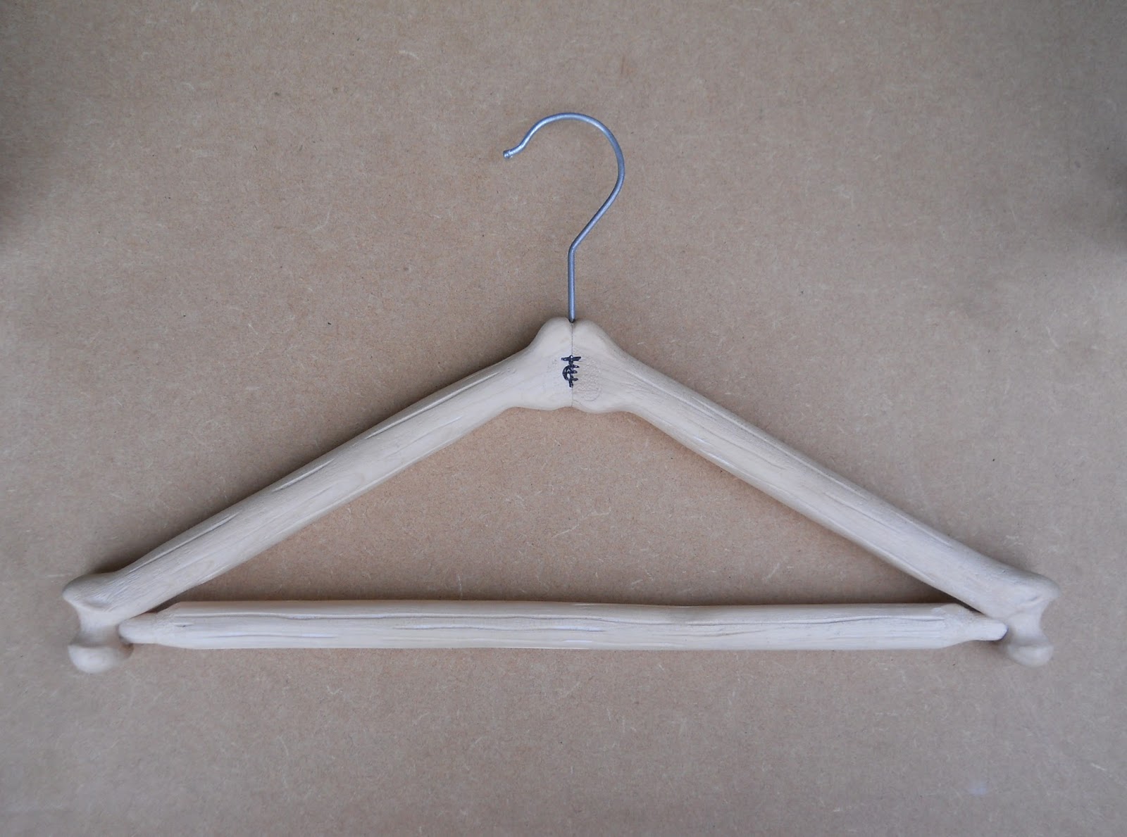 An unusual carved wooden coat hanger commission Carvings with Stories