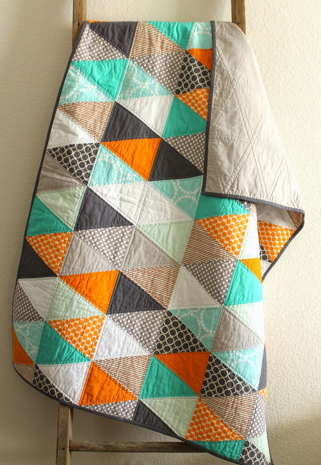 craftyblossom orange and aqua isosceles triangle quilt.