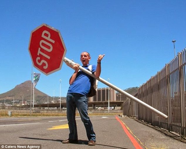 Getting a little extra help to convince motorists to stop in South Africa. - A Big Thumbs Up. Traveller Hitchhikes 100,000 Miles Around The World Without Spending Any Money Getting a little extra help to convince motorists to stop in South Africa. - A Big Thumbs Up. Traveller Hitchhikes 100,000 Miles Around The World Without Spending Any Money