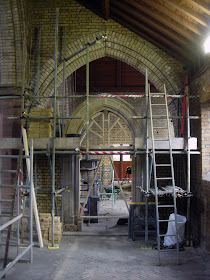 Completed stone arch and hood moulding now the brickwork is filling in the walls