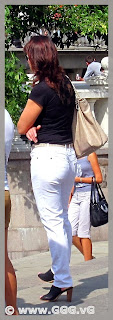 Slender lady in white jeans on the street