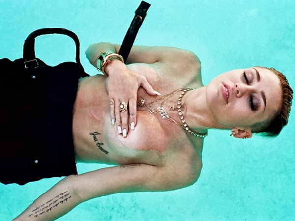 Miley Cyrus covered topless in Rolling Stone Mag