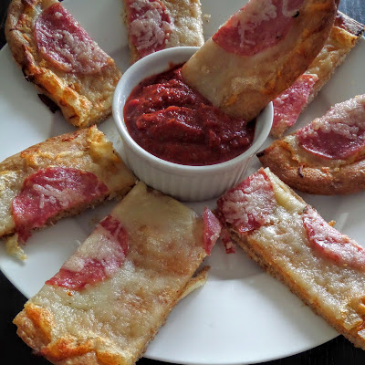 Crispy Pizza Sticks:  Crispy cheesy bread sticks with garlic and salami dipped in marinara sauce.  A great finger food for gameday or a party.