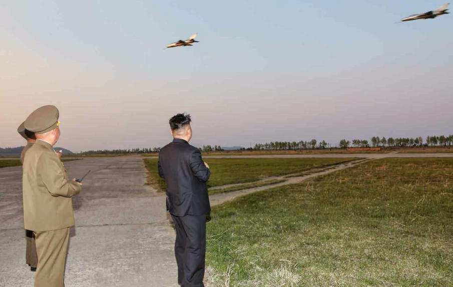 النشاطات العسكريه للزعيم الكوري الشمالي كيم جونغ اون .......متجدد  Kim+Jong-un+guiding+Air+Force+MiG-21+during+flight+training+2