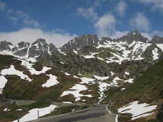 Snow-streaked rock walls along the road to the Furkapass from the east, Switzerland