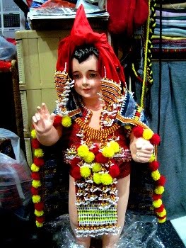 Dressing up a Santo Niño Figure in Gaddang Tribe Costume