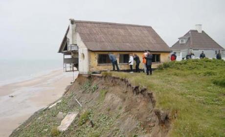 House-falling-off-cliff.jpg