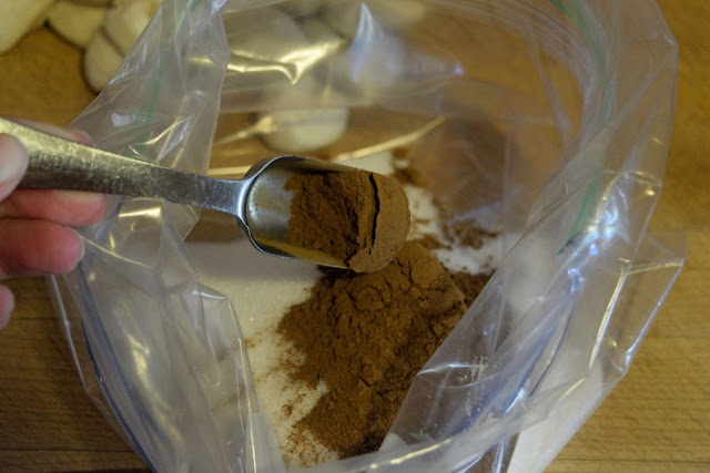 Cinnamon being added to the resealable bag.  