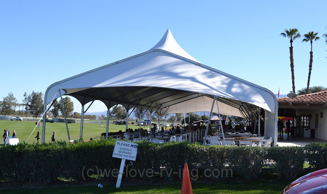 A large tent covers the dining room at the clubhouse