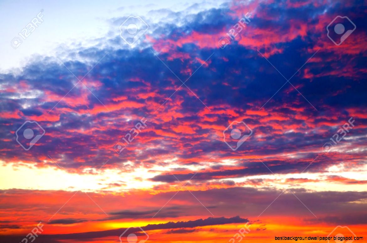 Dramatic Colorful Cloudy Sky In Red Orange Blue Colors At Sunset Dramatic Colorful Cloudy Sky In Red Orange Blue Colors At Sunset