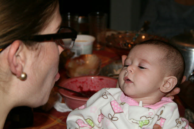 woman making silly faces at baby