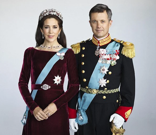 Re-styled glamour: To refresh her look, Mary (with Prince Frederik) accessorised the dress with different earrings and a necklace and wore the Order of the Elephant on a blue sash across her body