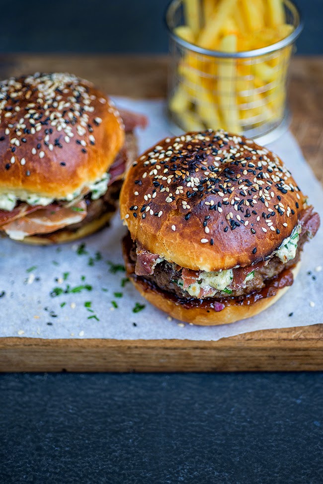 Blue cheese burgers on light brioche rolls with crispy pancetta and