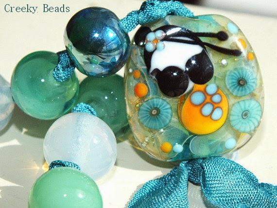 https://www.etsy.com/listing/189332319/handmade-lampwork-beads-turquoise?ref=favs_view_11