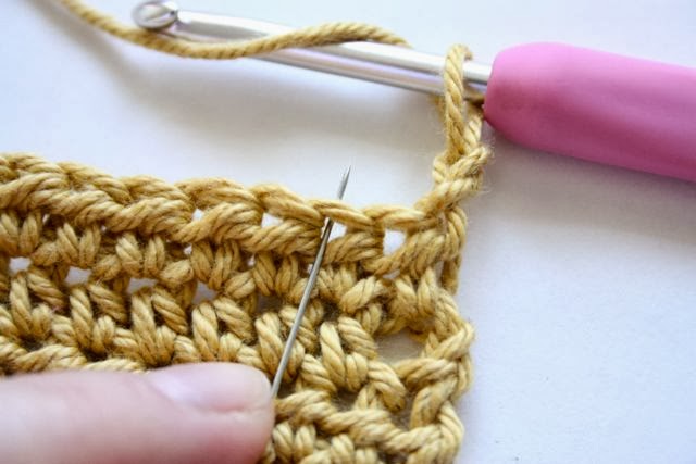 Skip the first stitch and work into the second stitch of the row