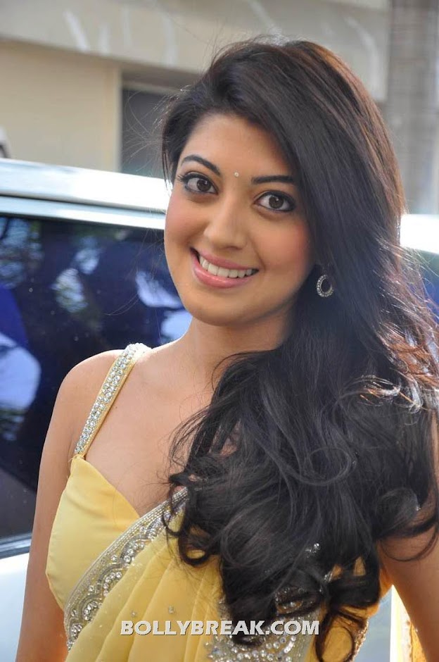 Pranitha posing in a light yellow sari with silver border - Pranitha yellow sari latest photoshoot pics