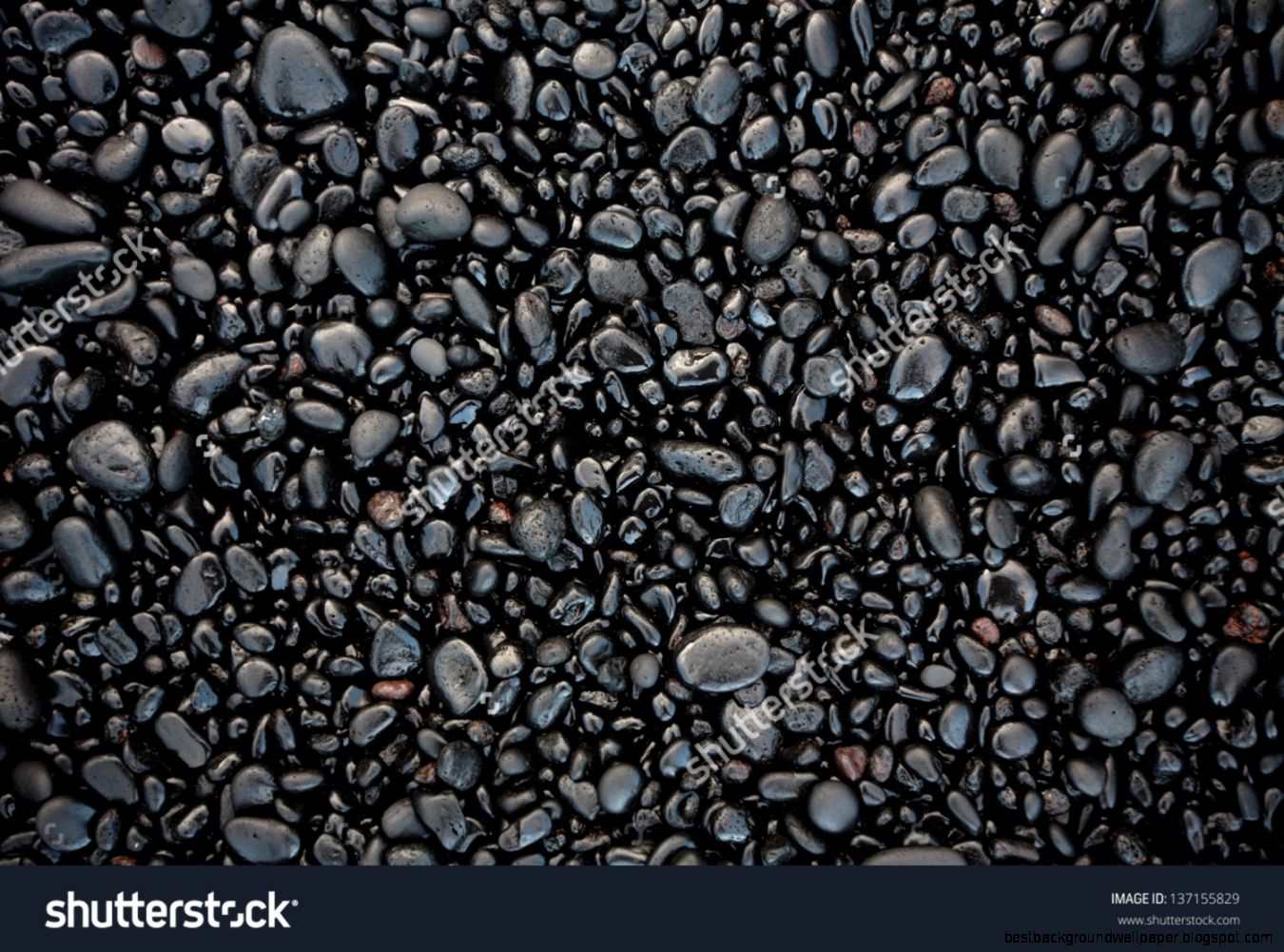 Black Stones On A Black Sand Beach As A Background Hawaii Maui Black Stones On A Black Sand Beach As A Background Hawaii Maui