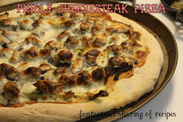 Philly Cheesesteak Pizza - delicious steak, sauteed veggies, and ooey gooey Provolone take this pizza to the next level #pizza #Phillycheesesteak