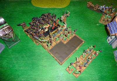 A Warhammer Fantasy Battle Report between Warriors of Chaos and Savage Orcs.