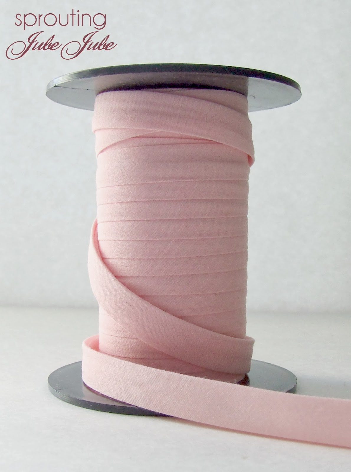 Sprouting JubeJube Using Bias Tape to Trim a Receiving Blanket