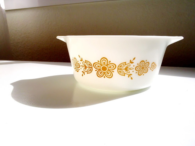 white and orange floral pyrex bowl