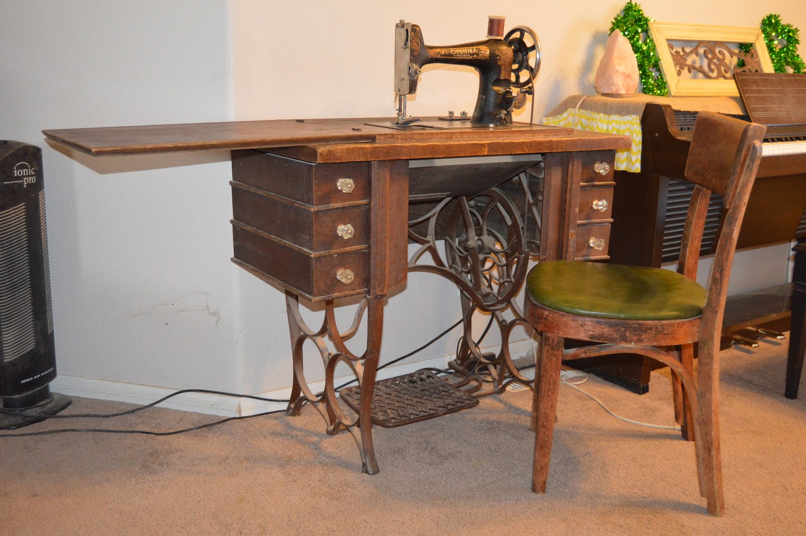 Antique sewing machine and chair $sold