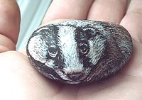 Hand painted Spiritkeepers Stones badger, by Tree Pruitt.